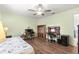 Bedroom with desk workspace and wood-look floors at 17925 Se 100Th Ter, Summerfield, FL 34491