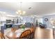 Open concept dining area with kitchen and living room views at 17925 Se 100Th Ter, Summerfield, FL 34491