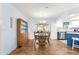 Bright dining area with wood floors and access to a patio at 17925 Se 100Th Ter, Summerfield, FL 34491