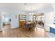 Bright dining area with wood floors and access to a patio at 17925 Se 100Th Ter, Summerfield, FL 34491