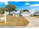 Single story home with attached garage and landscaped yard at 17925 Se 100Th Ter, Summerfield, FL 34491