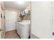 Laundry room with washer, dryer, and shelving for storage at 17925 Se 100Th Ter, Summerfield, FL 34491