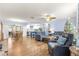 Open living room and kitchen with hardwood floors at 17925 Se 100Th Ter, Summerfield, FL 34491