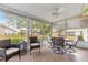 Screened porch with patio furniture overlooking backyard at 17925 Se 100Th Ter, Summerfield, FL 34491