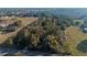 Aerial view of a large property with mature trees and open fields at 22740 County Road 44A, Eustis, FL 32736