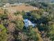 Aerial view of a single-story home with a metal roof at 22740 County Road 44A, Eustis, FL 32736