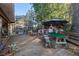 Spacious back deck with built-in pizza oven, seating, and a screened enclosure at 22740 County Road 44A, Eustis, FL 32736