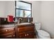 Well-appointed bathroom with granite vanity and updated toilet at 22740 County Road 44A, Eustis, FL 32736