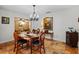 Elegant dining room with wood table and chandelier at 22740 County Road 44A, Eustis, FL 32736