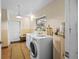 Laundry room with washer, dryer, and extra storage at 22740 County Road 44A, Eustis, FL 32736