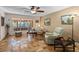 Relaxing living area with large windows, comfortable seating, and tile floors at 22740 County Road 44A, Eustis, FL 32736