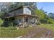 Small outbuilding with covered porch and storage area at 22740 County Road 44A, Eustis, FL 32736