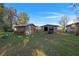 Several rustic wooden outbuildings, including a barn and sheds at 22740 County Road 44A, Eustis, FL 32736