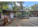 Outdoor kitchen and dining area with pizza oven and grill at 22740 County Road 44A, Eustis, FL 32736
