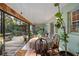 Relaxing screened porch with access to a deck and backyard at 22740 County Road 44A, Eustis, FL 32736