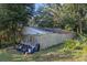 Rustic storage shed with metal roof and partial wall siding at 22740 County Road 44A, Eustis, FL 32736