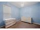 Bedroom with white dresser and a chandelier at 2314 Se 75Th Blvd, Bushnell, FL 33513