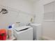 Laundry room with washer, dryer, and shelving at 2314 Se 75Th Blvd, Bushnell, FL 33513