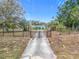 Ranch style home with gated entrance and lush landscaping at 2509 Dowman Dr, Apopka, FL 32712