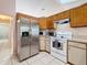 Kitchen with stainless steel appliances and wood cabinets at 2509 Dowman Dr, Apopka, FL 32712