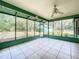 Large screened porch overlooking backyard at 2509 Dowman Dr, Apopka, FL 32712