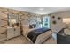 Bright bedroom with a comfortable bed and geometric wall art at 2986 Supermarine Rd, Tavares, FL 32778