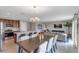 Bright dining area with open concept to kitchen and living room at 2986 Supermarine Rd, Tavares, FL 32778