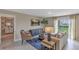 Cozy living area with sliding glass doors to backyard at 2986 Supermarine Rd, Tavares, FL 32778