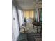 Bright sunroom with multiple windows and a ceiling fan at 30 Riverview Dr, Fruitland Park, FL 34731