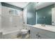 Bathroom with bathtub, toilet and white vanity at 3141 Britannia Blvd # D, Kissimmee, FL 34747