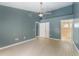 Spacious bedroom with ensuite bathroom access and ceiling fan at 3141 Britannia Blvd # D, Kissimmee, FL 34747