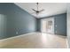 Bright bedroom with wood-look floors and access to balcony at 3141 Britannia Blvd # D, Kissimmee, FL 34747