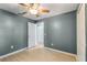 Well-lit bedroom with wood-look floors and an adjacent closet at 3141 Britannia Blvd # D, Kissimmee, FL 34747