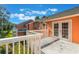 Deck access from condo, featuring French doors and treetop views at 3141 Britannia Blvd # D, Kissimmee, FL 34747