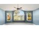 Living room featuring hardwood floors and an arched window with a view at 3141 Britannia Blvd # D, Kissimmee, FL 34747