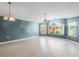 Bright living room with hardwood floors and a large window at 3141 Britannia Blvd # D, Kissimmee, FL 34747