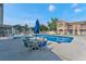Refreshing community pool with hot tub and seating area at 3141 Britannia Blvd # D, Kissimmee, FL 34747