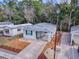 Single-story house with carport, landscaping, and trees nearby at 32314 Oak Park Dr, Leesburg, FL 34748