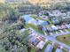 House nestled in a community near a lake at 32314 Oak Park Dr, Leesburg, FL 34748