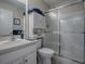 Clean bathroom with white vanity, toilet, and shower at 32314 Oak Park Dr, Leesburg, FL 34748