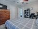 Bedroom with double bed, dresser, and home office area at 32314 Oak Park Dr, Leesburg, FL 34748