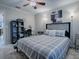Bedroom with double bed, ceiling fan, and workspace at 32314 Oak Park Dr, Leesburg, FL 34748