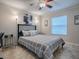 Bedroom with a double bed, ceiling fan, and home office at 32314 Oak Park Dr, Leesburg, FL 34748