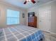 Spacious bedroom with dresser, window blinds, and a comfy bed at 32314 Oak Park Dr, Leesburg, FL 34748