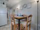 Small dining area with four-person table and chairs at 32314 Oak Park Dr, Leesburg, FL 34748