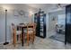 Bright dining area with table and four chairs, adjacent to living room at 32314 Oak Park Dr, Leesburg, FL 34748