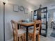 Dining area with four chairs and a room divider at 32314 Oak Park Dr, Leesburg, FL 34748