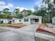 House exterior with driveway and landscaping at 32314 Oak Park Dr, Leesburg, FL 34748