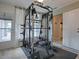 Home gym with weight machine and mirrors at 32314 Oak Park Dr, Leesburg, FL 34748