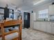 White kitchen with view into dining area and living room at 32314 Oak Park Dr, Leesburg, FL 34748